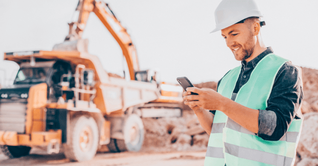 An equipment rental field service executive accessing data remotely from the mobile app