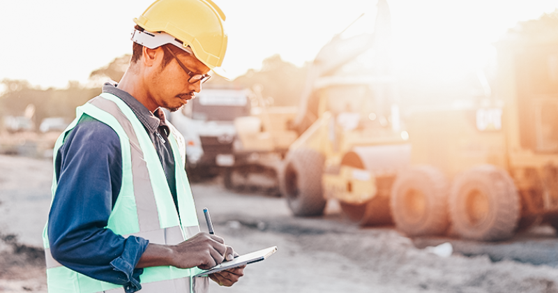 A field service executive using equipment rental ERP to streamline rental maintenance